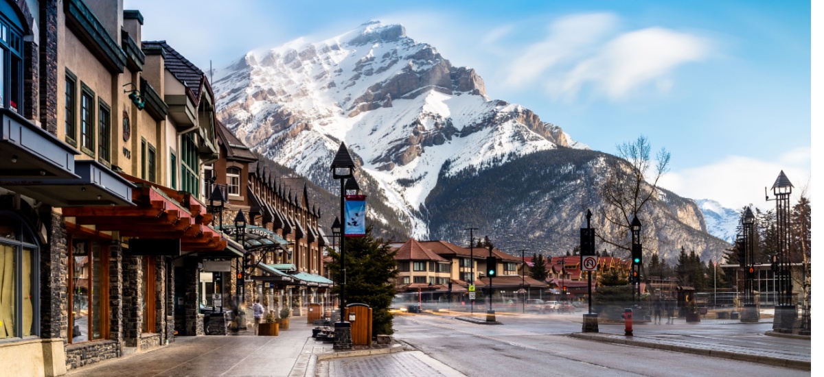 Canadian town with snow capped mountain in background