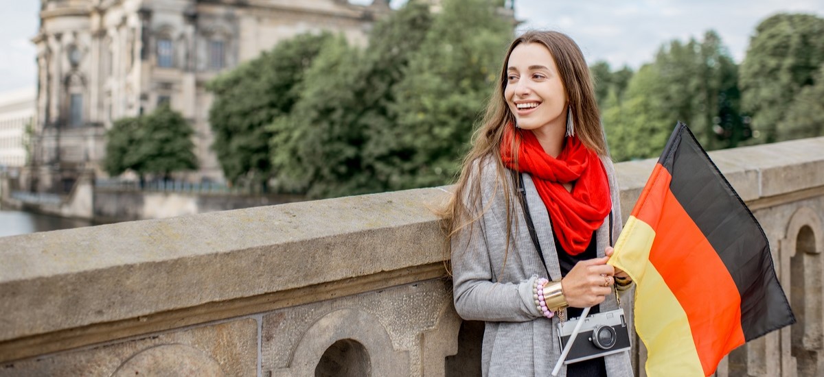 Smiling woman with German flag