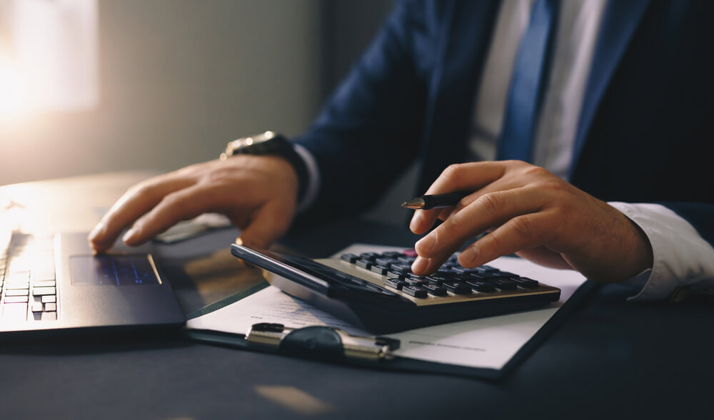 businessman-filling-out-tax-forms