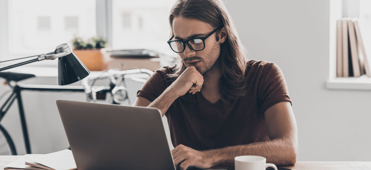 thoughtful-businessman-with-laptop